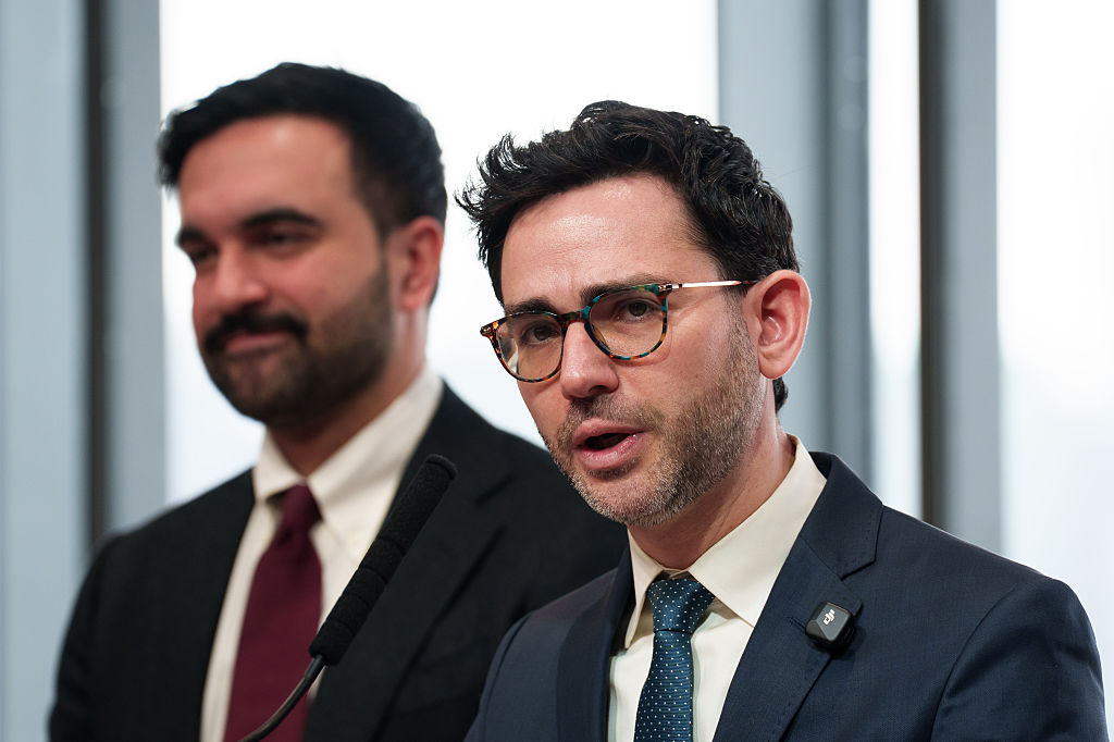 Commissioner Sam Levine speaking while Mayor Zohran Mamdani stands in the background.