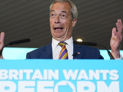 Nigel Farage gestures while speaking at a podium that reads "Britain Wants Reform."