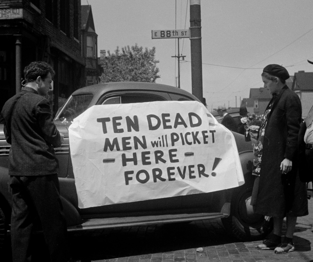 Two onlookers at the site of Chicago's 1937 Memorial Day Massacre