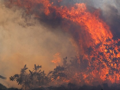 Firefighters bring a wildfire under control on April 30, 2026, in Bonhill, Scotland.