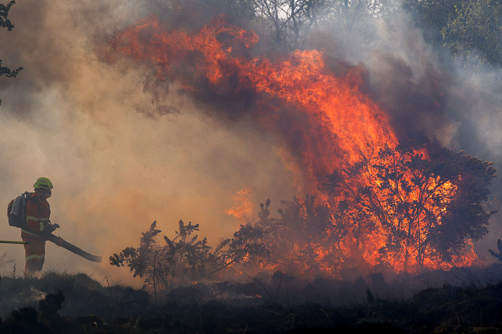 Firefighters bring a wildfire under control on April 30, 2026, in Bonhill, Scotland.