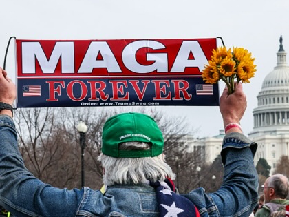 A demonstrator holds a sign that reads "MAGA Forever" outside the US Capitol, marking the fifth anniversary of the riot on January 6, 2021. 