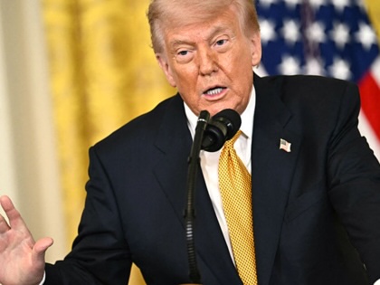 Donald Trump speaking at a podium.