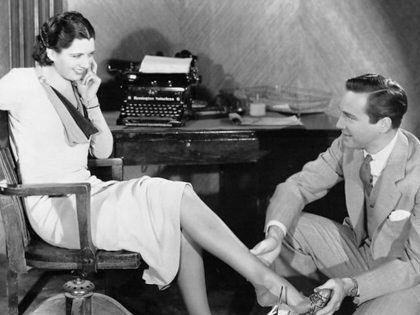A still of Kay Francis and David Manners in the film Man Wanted. 