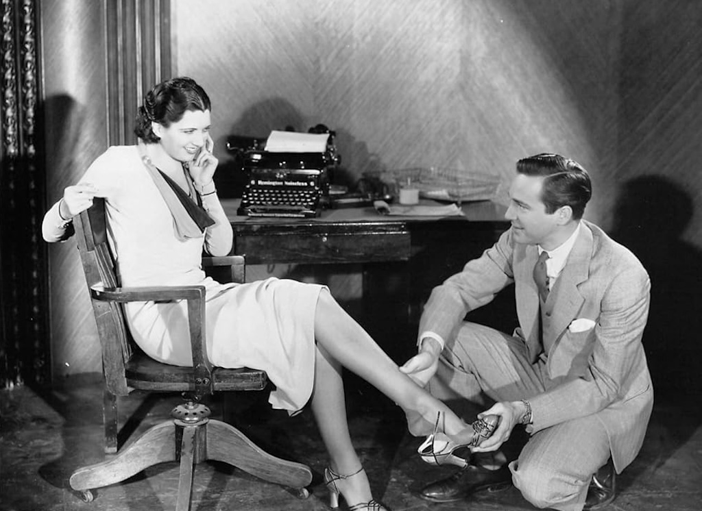 A still of Kay Francis and David Manners in the film Man Wanted. 