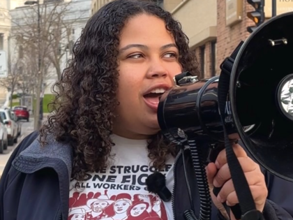 Juliana Bennett speaking into a megaphone.