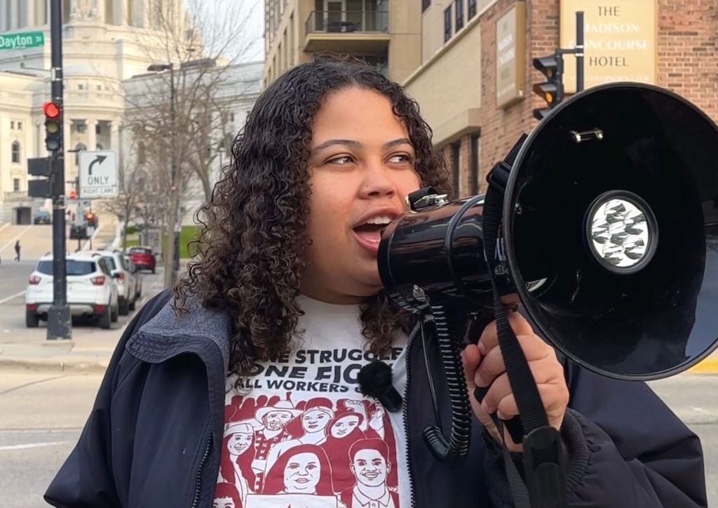 Juliana Bennett speaking into a megaphone. 