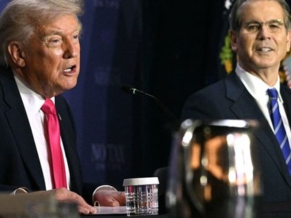 President Donald Trump speaks, flanked by US Secretary of the Treasury Scott Bessent, during a roundtable discussion on his "no tax on tips" policy at the AC Hotel Las Vegas Symphony Park in Las Vegas, Nevada, on April 16, 2026.