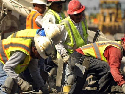 A construction crew works in Denver, Colorado.