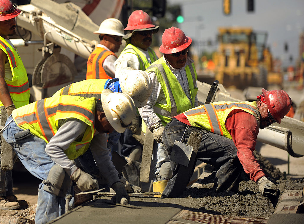 A construction crew works in Denver, Colorado.
