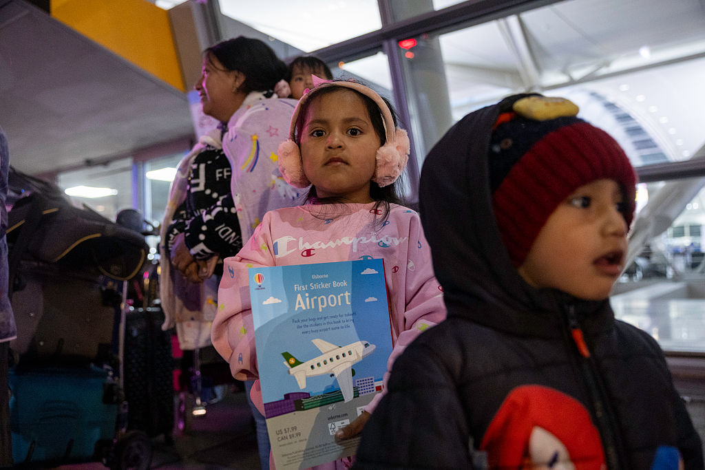 Undocumented Ecuadorian immigrant Jazlyn, six, and her cousin Adrian, three, arrive to JFK International Airport for a flight to Ecuador with their mothers on October 26, 2025, in New York, New York.
