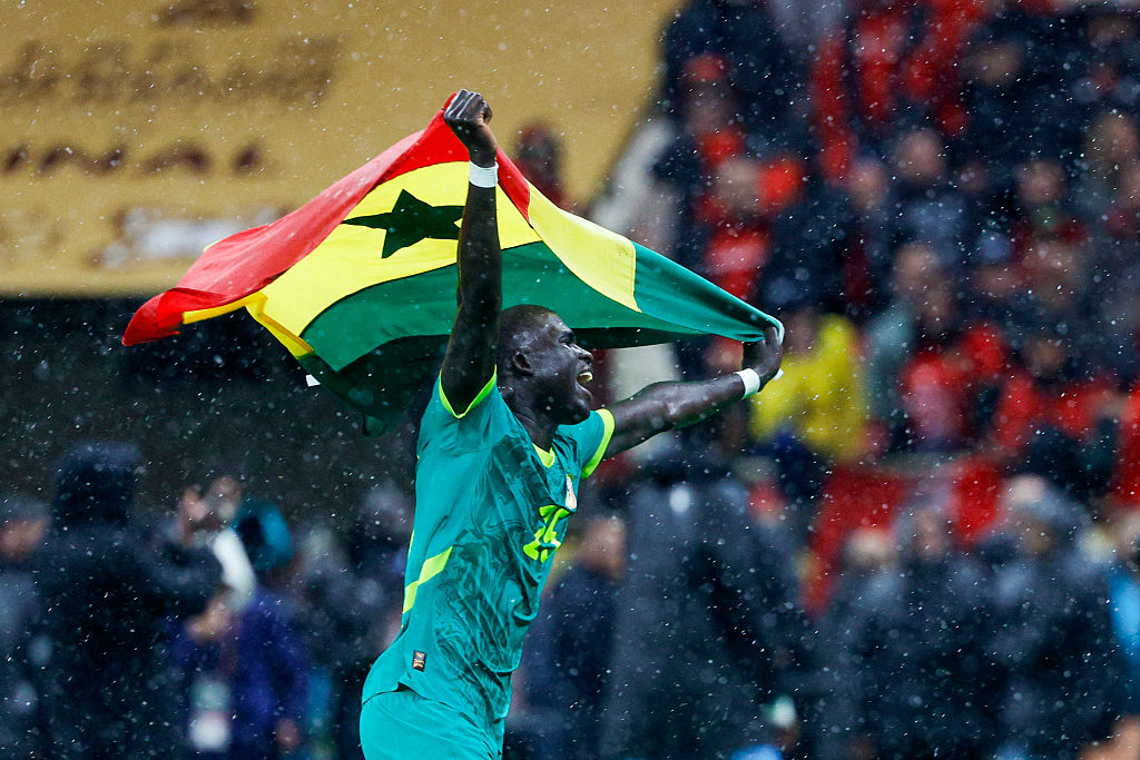 Senegal's defender El Hadji Malick Diouf celebrates his team’s victory at the end of the Africa Cup of Nations on January 18, 2026.