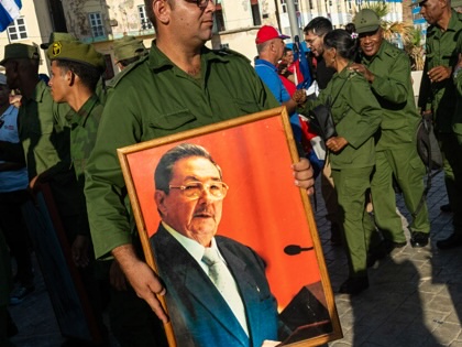 A man carries a portrait of Raúl Castro as demonstrators gather to protest the US indictment of Castro, in Havana, Cuba, on May 22, 2026.