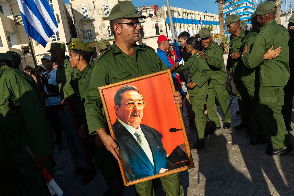 A man carries a portrait of Raúl Castro as demonstrators gather to protest the US indictment of Castro, in Havana, Cuba, on May 22, 2026. 