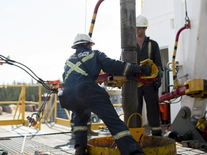 Employees torque a pipe at a wedge well at Christina Lake, a situ oil production facility half owned by Cenovus Energy Inc. and ConocoPhillips, in Conklin, Alberta, Canada, on Thursday, August 15, 2013.
