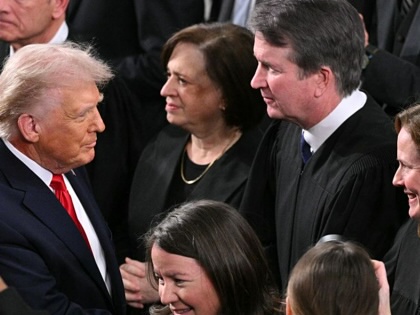 President Trump speaks with Supreme Court justices before the 2026 State of the Union address. 