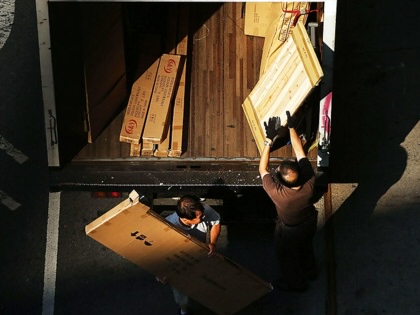 Men load a truck in New York City. 