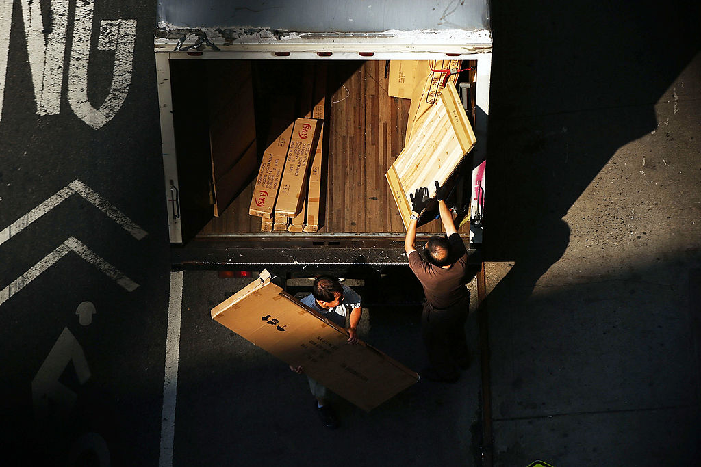 Men load a truck in New York City. 