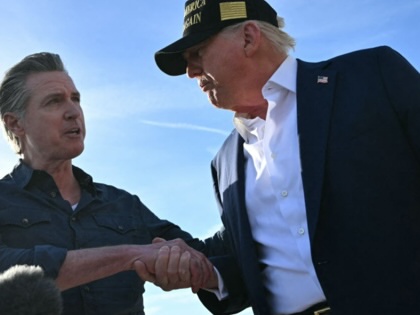 Gavin Newsom shakes hands with Donald Trump. 