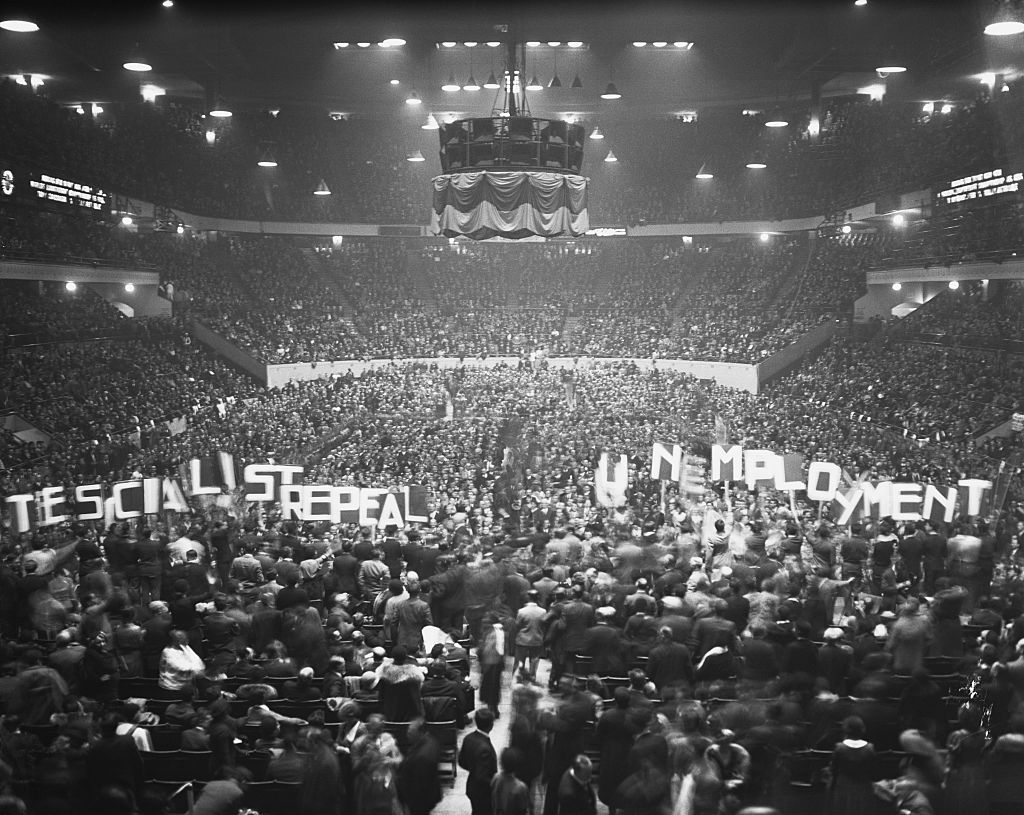 Madison Square Garden in New York jammed to capacity on November 3, 1932, as 22,000 socialists and their supporters gathered to hear the final plea for votes made by Norman Thomas, socialist candidate for president. A group of enthusiasts flaunted "Repeal Unemployment" signs.