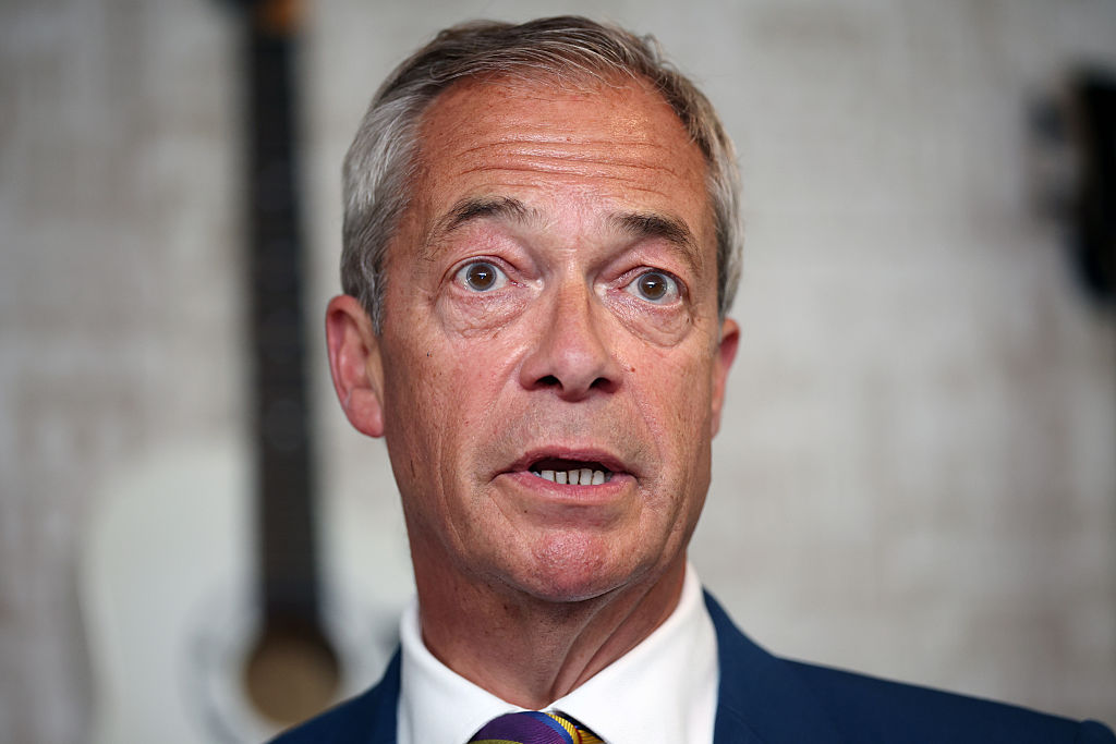 Reform UK leader Nigel Farage speaks to the media at The Dam Bar And Grill on May 8, 2026, in St Helens, England.