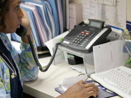 A medical assistant on the phone at Mount Sinai.