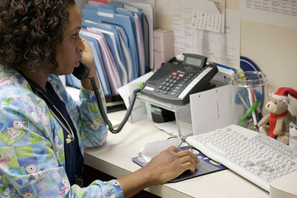 A medical assistant on the phone at Mount Sinai.