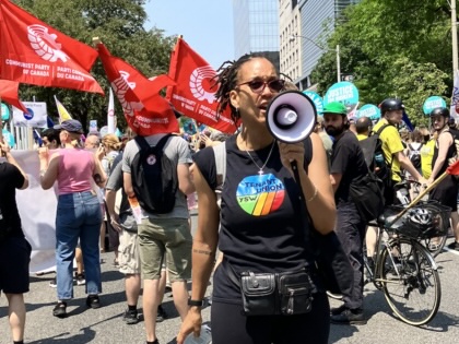 Toronto Tenant Union cochair Sharlene Henry speaks into a bullhorn at a rally.