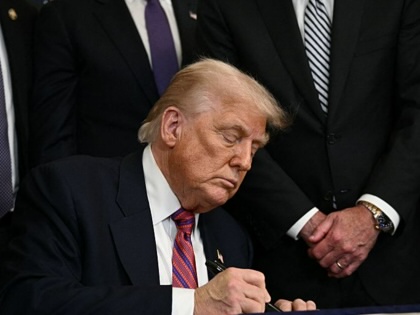 President Donald Trump signs the GENIUS Act, July 18, 2025.