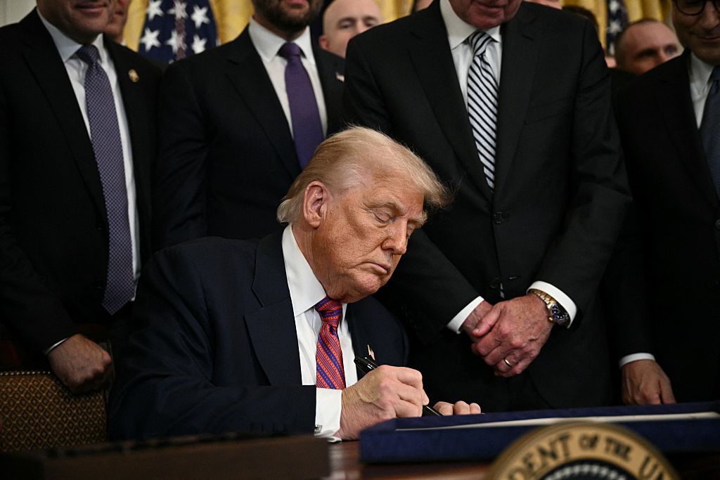 President Donald Trump signs the GENIUS Act, July 18, 2025. 