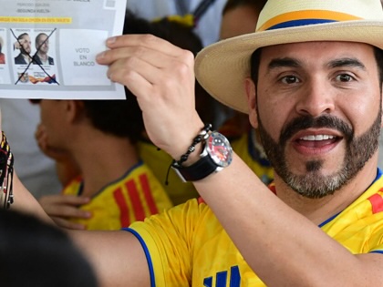 President-elect of Colombia, Abelardo de la Espriella, shows off his ballot.