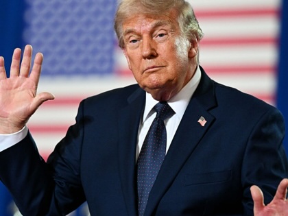 President Donald Trump waves after landing at Morristown Municipal Airport and prior to boarding Marine One on May 22, 2026, in Hanover, New Jersey.