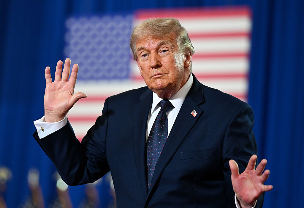 President Donald Trump waves after landing at Morristown Municipal Airport and prior to boarding Marine One on May 22, 2026, in Hanover, New Jersey.