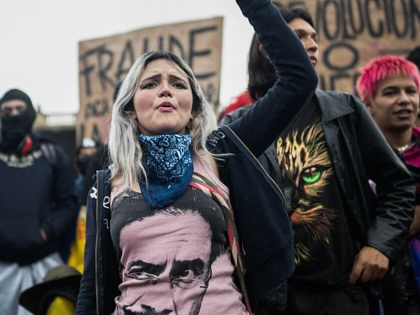 Colombians take part in a protest against the results of the presidential runoff election in Bogotá, on June 22, 2026.