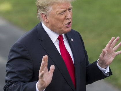 Donald Trump speaks to members of the media before boarding Marine One in Washington, DC, on October 9, 2018. 