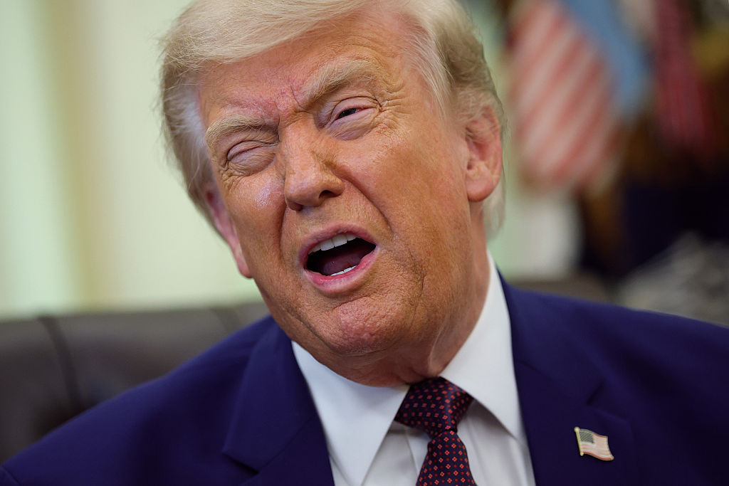 WASHINGTON, DC - JUNE 03: U.S. President Donald Trump reacts during an event in the Oval Office of the White House on June 03, 2026 in Washington, DC. Trump signed executive orders related to strengthening customs enforcement and reforms to federal work laws.