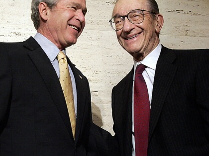 George W. Bush smiles with retired Federal Reserve Chairman Alan Greenspan  in Washington, DC, February 6, 2006. 