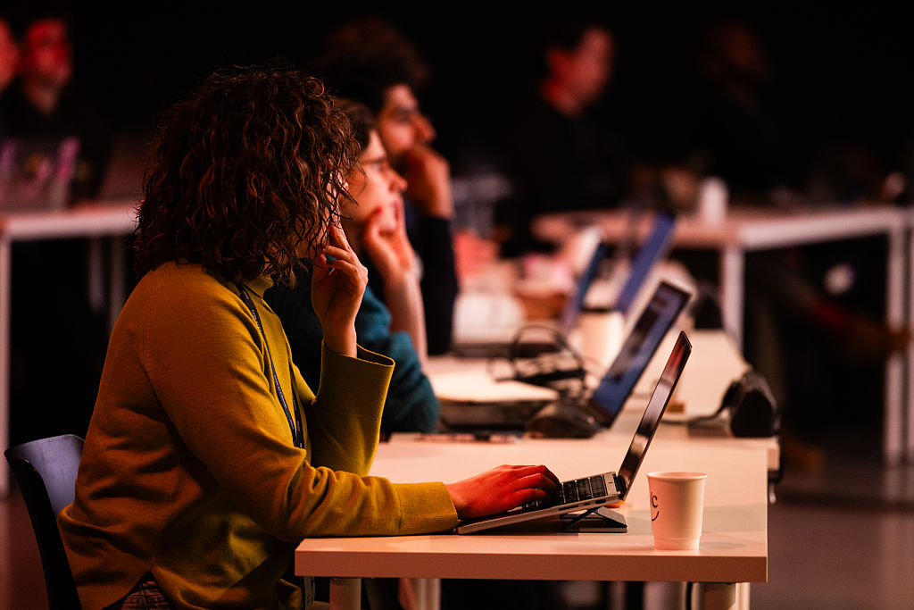 Attendees watch a demonstration of Anthropic PBC's Claude Code software at a conference in London.