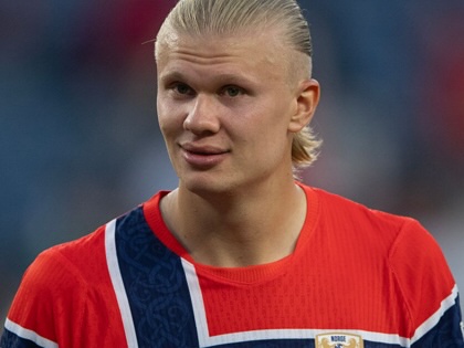 Erling Haaland smiles after match