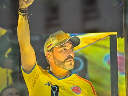Colombia's presidential candidate Abelardo de la Espriella of the Salvadores de la Patria movement gestures as he speaks to supporters behind bulletproof glass during a campaign rally in Cartagena, Colombia, on June 9, 2026.