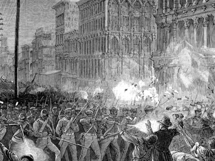 Militia units fire on striking railroad workers in Baltimore, 1877.