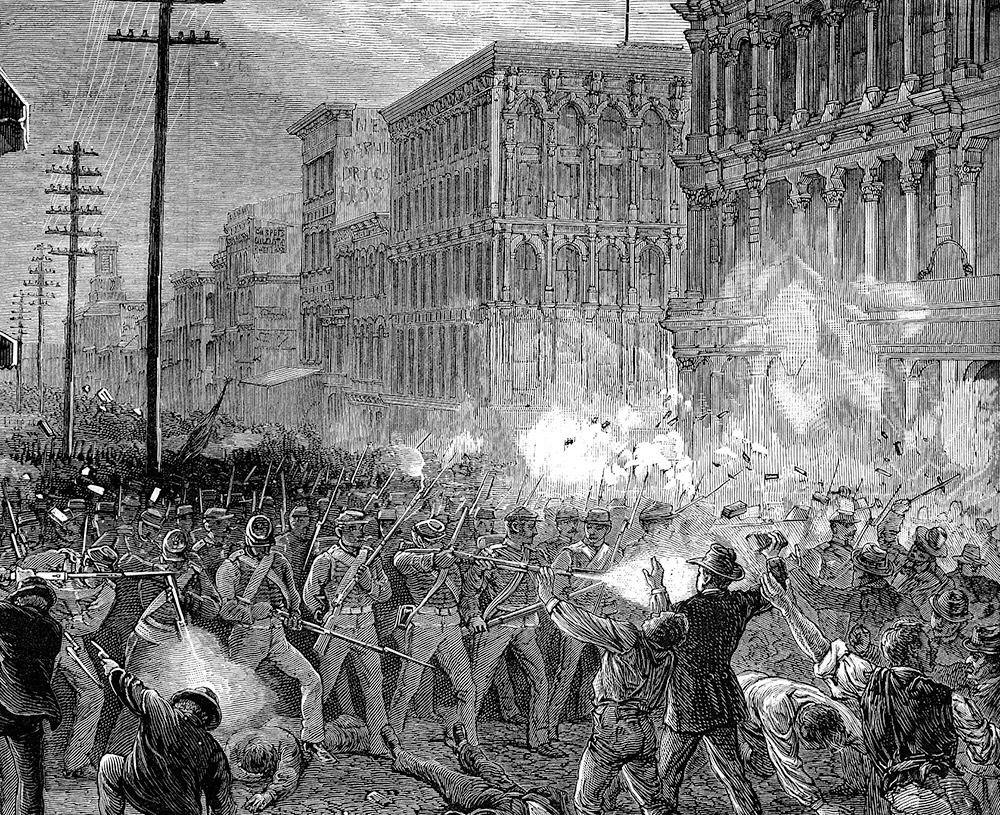 Militia units fire on striking railroad workers in Baltimore, 1877.