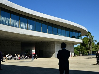 People walk around the curved architecture of the David Geffen Galleries at the Los Angeles County Museum of Art (LACMA) on April 15, 2026, in Los Angeles, California.