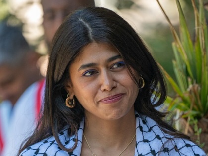 Rima Hassan, French member of the European Parliament, listens to speeches during the honorary citizenship ceremony held in her honor in La Courneuve, appearing focused and attentive, in La Courneuve, France, July 4, 2026. 