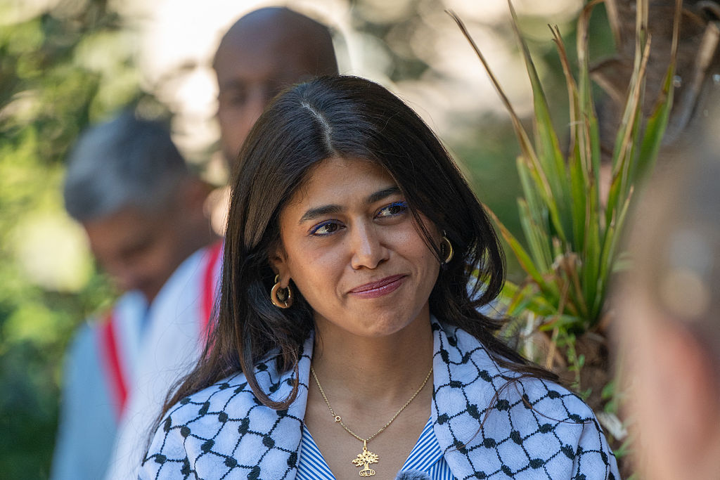 Rima Hassan, French member of the European Parliament, listens to speeches during the honorary citizenship ceremony held in her honor in La Courneuve, appearing focused and attentive, in La Courneuve, France, July 4, 2026. 