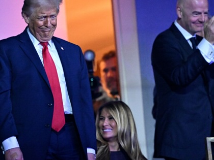Donald Trump, Melania Trump, and Gianni Infantino react during the FIFA World Cup 2026 Official Draw at the Kennedy Center on December 5, 2025, in Washington, DC.