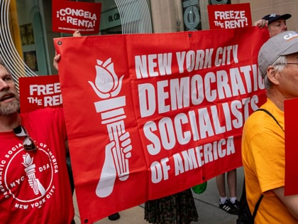 Demonstrators hold a "Democratic Socialists of America" banner ahead of a vote by the Rent Guidelines Board at El Museo del Barrio in New York, US, on Thursday, June 25, 2026.