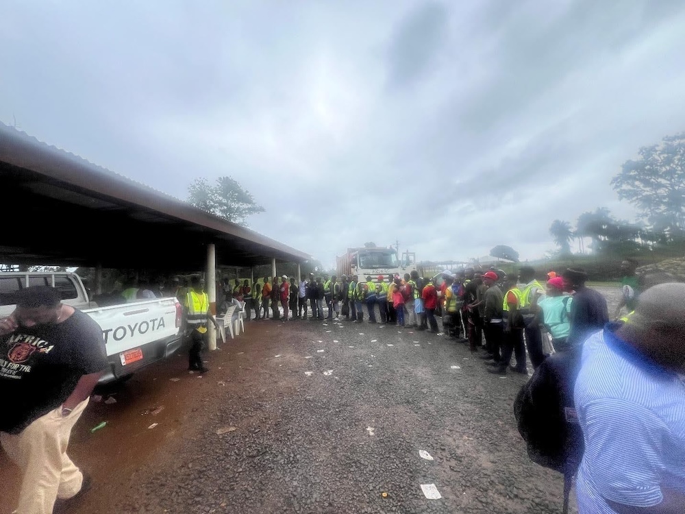 Liberian workers wait in line to vote for a union.
