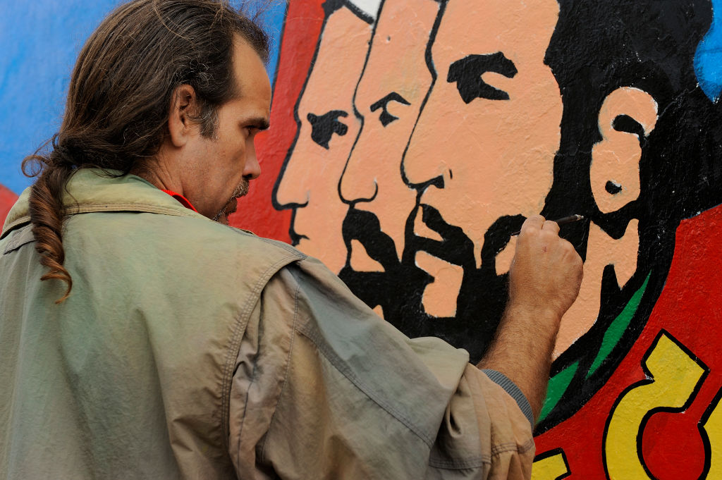 The painting of a fresco on a Havana wall.