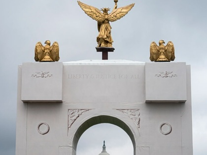 The US Capitol stands behind a replica of the planned Triumphal Arch on the fourth day of the "Great American State Fair" on the National Mall on June 28, 2026, in Washington, DC.